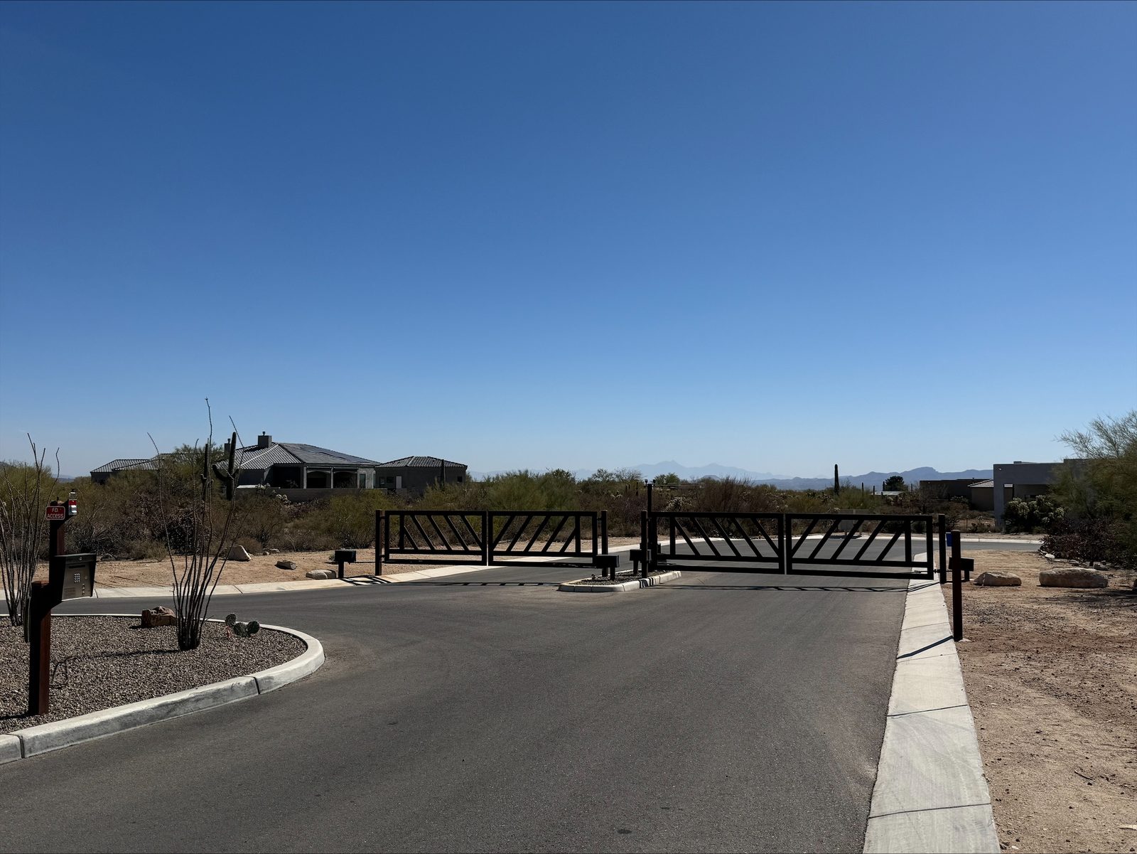 Desert estate community entry gate with mountain vista — Signal Gates